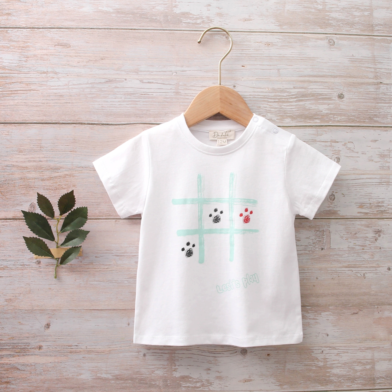 Imagen de Camiseta bebé algodón blanca estampado huellas perros