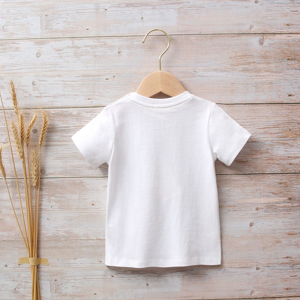 Imagen de Camiseta bebé niño blanca con estampado étnico