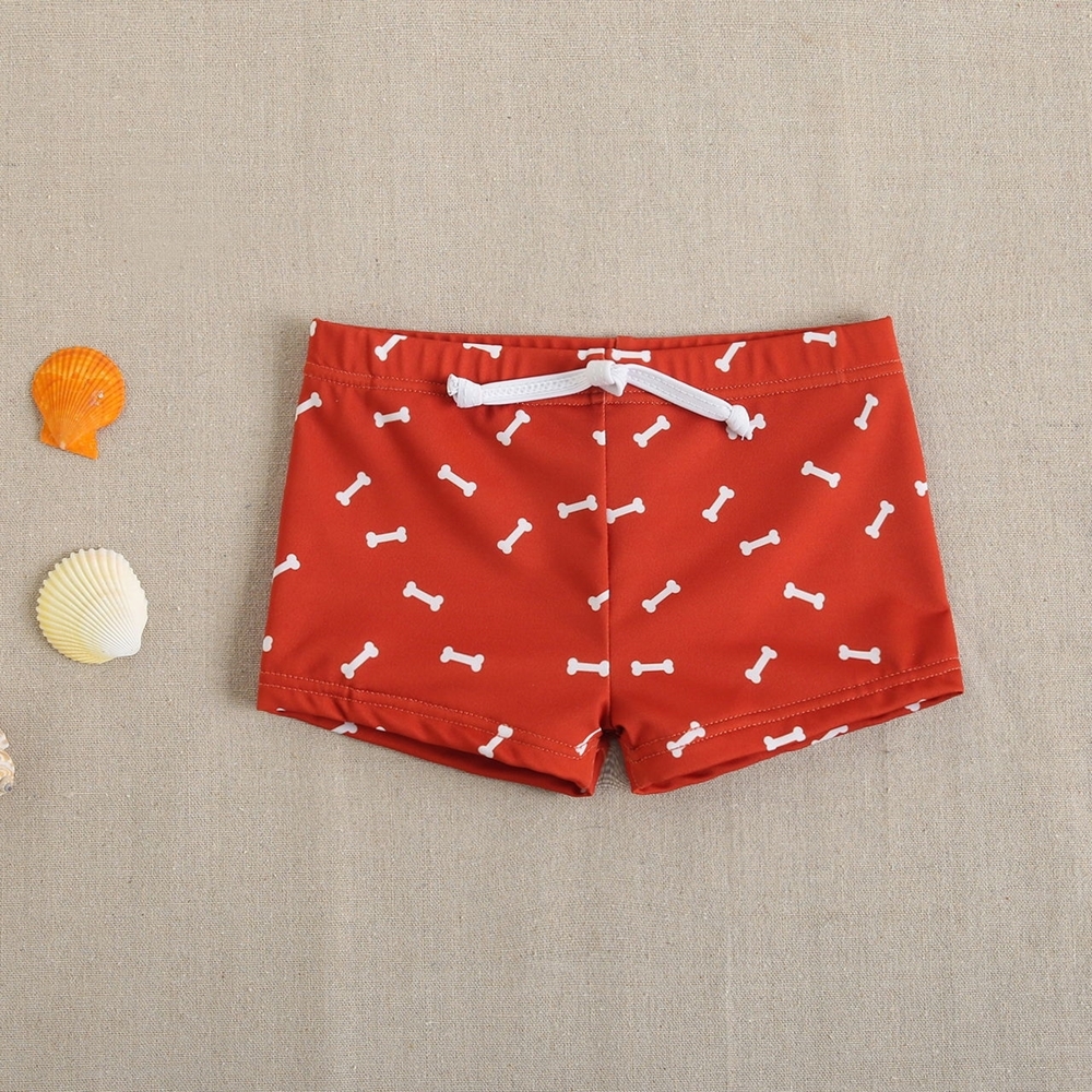 Imagen de Bañador bóxer de bebé niño en color rojo estampado y cordón elástico de color blanco