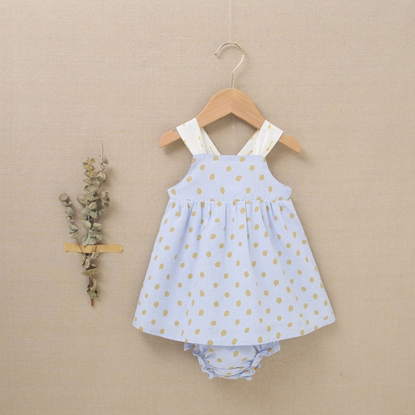 Imagen de Vestido de bebé niña con cubrepañal azul con estampado de lunares