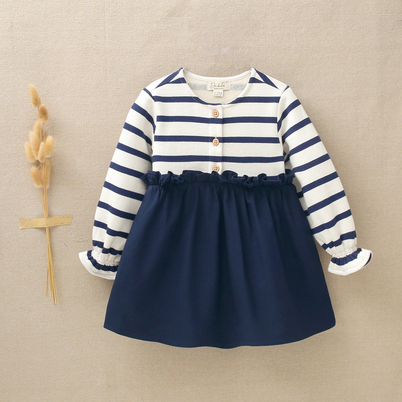 Imagen de Vestido de bebé niña combinado de rayas marineras con tejido liso azul