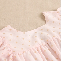 Imagen de Vestido de niña rosa con lunares dorados