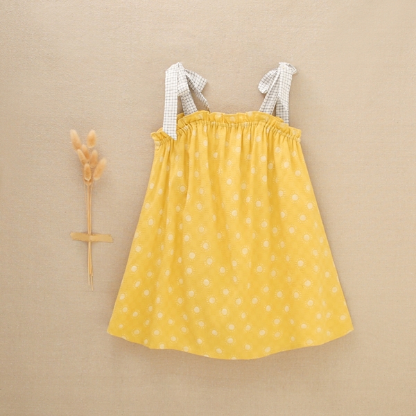 Imagen de Vestido de niña amarillo mostaza con estampado de soles