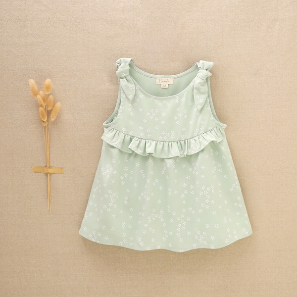 Imagen de Blusa de niña sin mangas en color verde con flores blancas