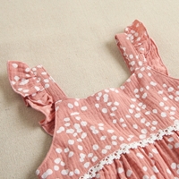 Imagen de Vestido de niña en bambula de color rosa con estampado de topos blancos