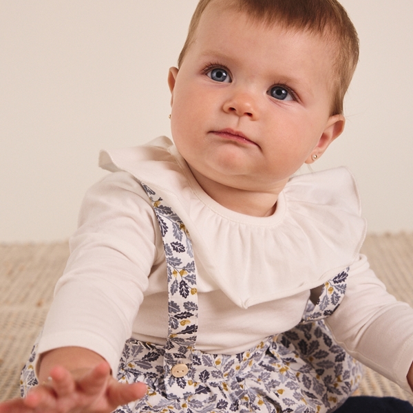 Imagen de Ranita de bebé niña con estampado de hojas azul y mostaza