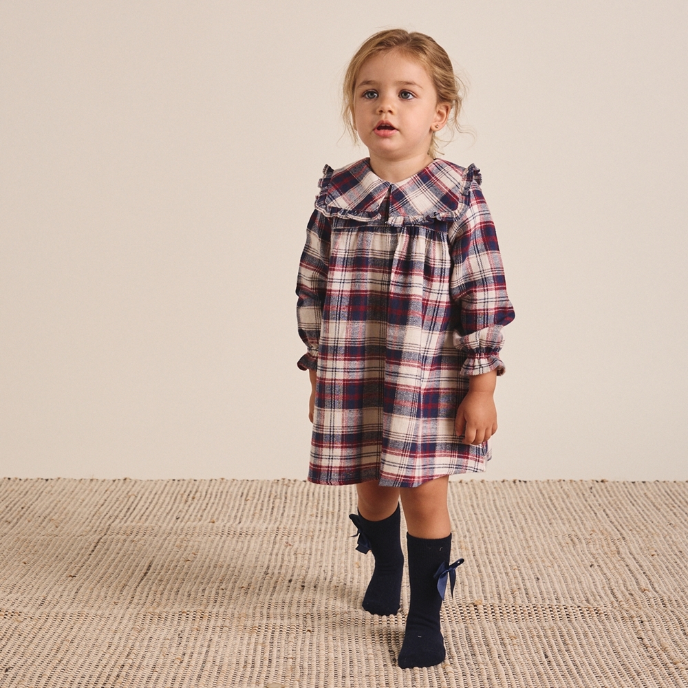 Imagen de Conjunto de bebé niña de vestido de franela de cuadros tartán y calcetines azul marino con lazo